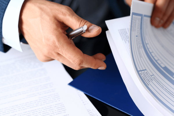 loss assessor looking through files