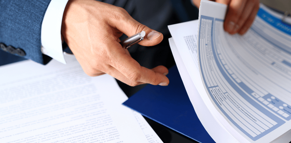 loss assessor looking through files